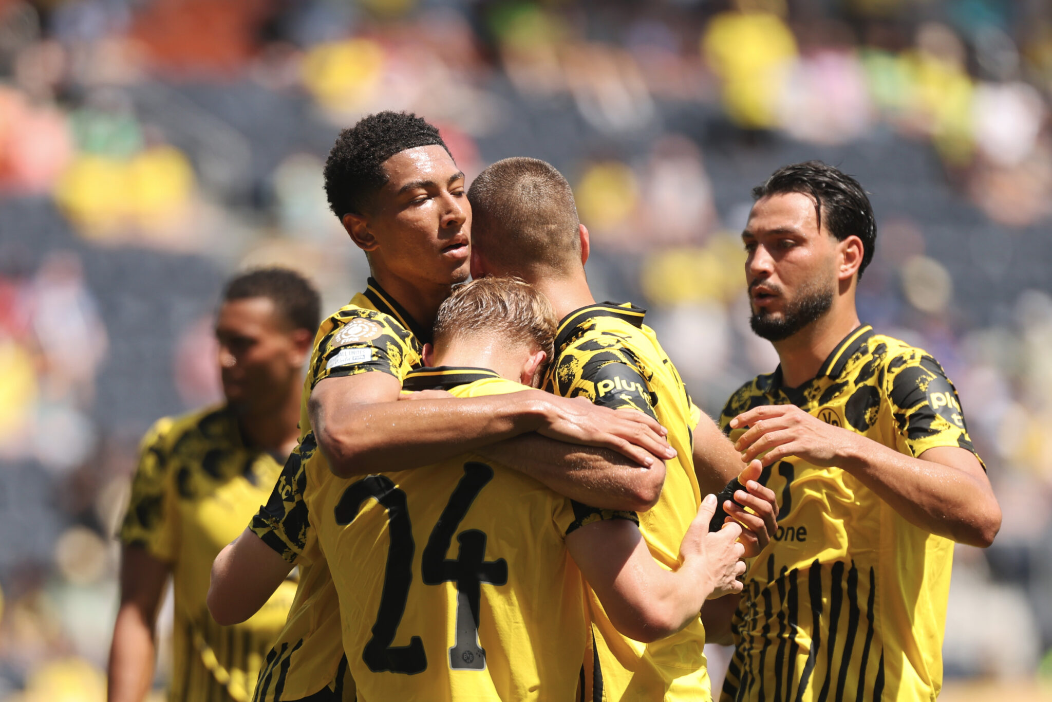 Borussia Dortmund players celebrate a goal together.