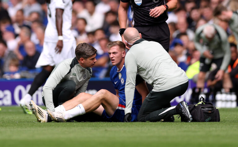 Liam Delap of Chelsea receives medical treatment during the Premier League match between Chelsea and Fulham at Stamford Bridge on August 30, 2025 in London, England.
