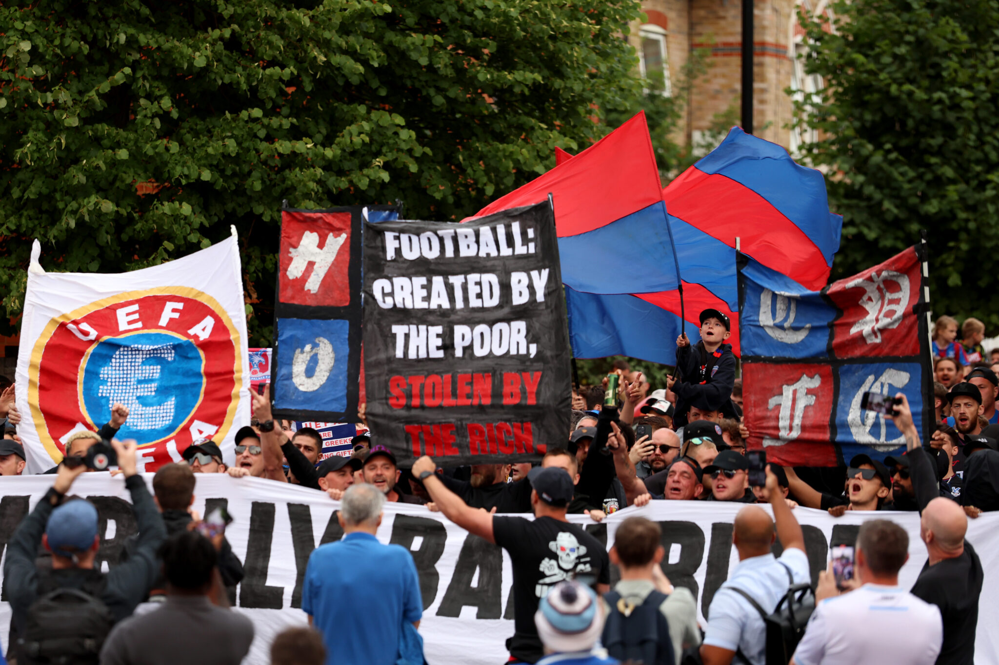 Crystal Palace fans protest against the UEFA decision to demote the club from Europa league to the Europa conference league outside Selhurst Park stadium on July 15, 2025 in London, England.