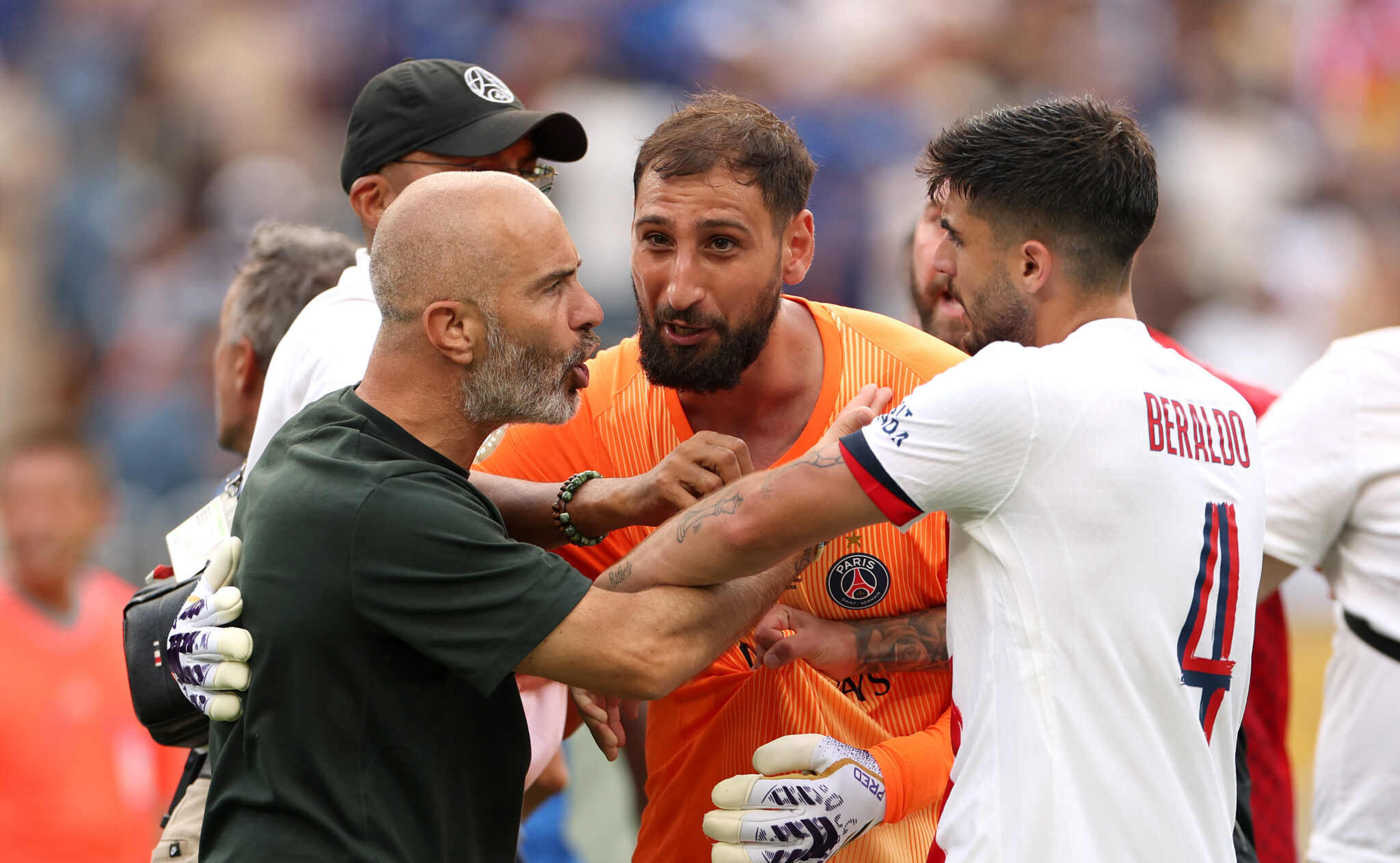 Gianluigi Donnarumma #1 of Paris Saint-Germain engages with Enzo Maresca, Head Coach of Chelsea FC, and Lucas Beraldo #4 following the FIFA Club World Cup 2025 Final match between Chelsea FC and Paris Saint-Germain at MetLife Stadium on July 13, 2025 in East Rutherford, New Jersey.