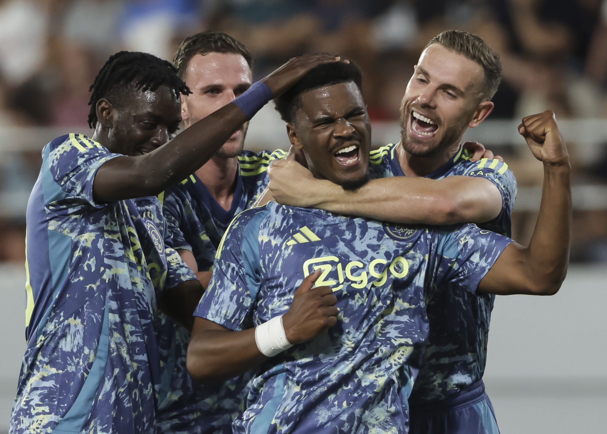 Chelsea transfer target Jorrel Hato (C) celebrates after scoring a goal with Devyne Rensch (L) and Jordan Henderson (R) during the UEFA Europa League Second Qualifying Round 2nd leg match between FK Vojvodina and FC Ajax at TSC Arena on August 01, 2024 in Backa Topola, Serbia.