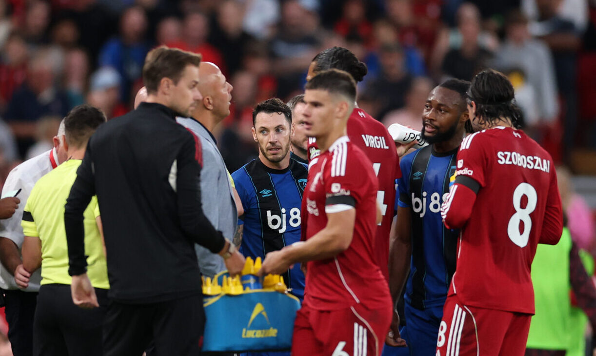 Liverpool players Virgil van Dijk and Dominik Szoboszlai and manager Arne Slot in discussion with AFC Bournemouth player Antoine Semenyo (2r) reported racist abuse from the crowd during the Premier League match between Liverpool and Bournemouth at Anfield on August 15, 2025 in Liverpool, England.