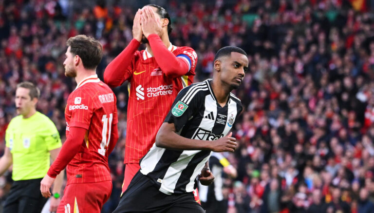 Alexander Isak of Newcastle United celebrates scoring his team's second goal as Virgil van Dijk of Liverpool looks dejected during the Carabao Cup Final between Liverpool and Newcastle United at Wembley Stadium on March 16, 2025 in London, England.