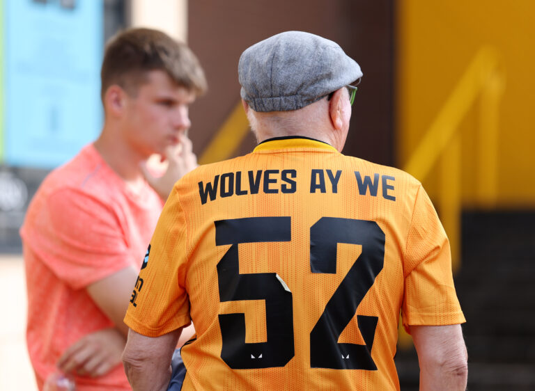 Premier League - A Wolverhampton Wanderers fan wears a team kit with the words "Wolves Ay We" and the number 52 prior to the Premier League match between Wolverhampton Wanderers and Manchester City at Molineux on August 16, 2025 in Wolverhampton, England.