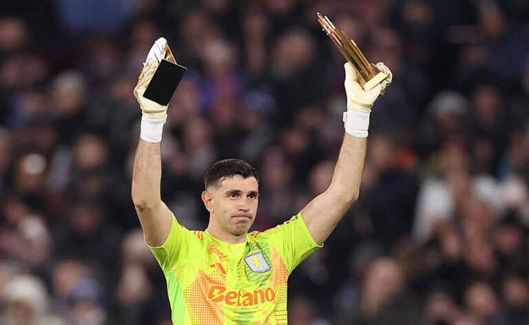 Premier League - Emiliano Martinez of Aston Villa acknowledges the fans as he presents his Yashin Trophies for the 2023 and 2024 seasons, after becoming the first goalkeeper to win a second and consecutive Yashin Trophy at the Ballon d'Or Awards on the 28th of October 2024, prior to the UEFA Champions League 2024/25 League Phase MD5 match between Aston Villa FC and Juventus at Villa Park on November 27, 2024 in Birmingham, England.