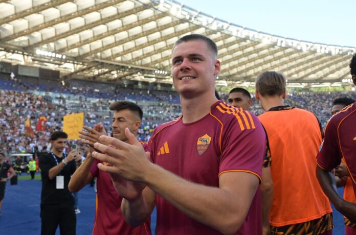 AS Roma striker Evan Ferguson applauds the fans.