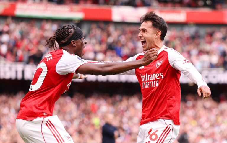 Arsenal midfielder Martin Zubimendi celebrates scoring his team's first goal with teammate Noni Madueke of Arsenal during the Premier League match between Arsenal and Nottingham Forest at Emirates Stadium on September 13, 2025 in London, England.