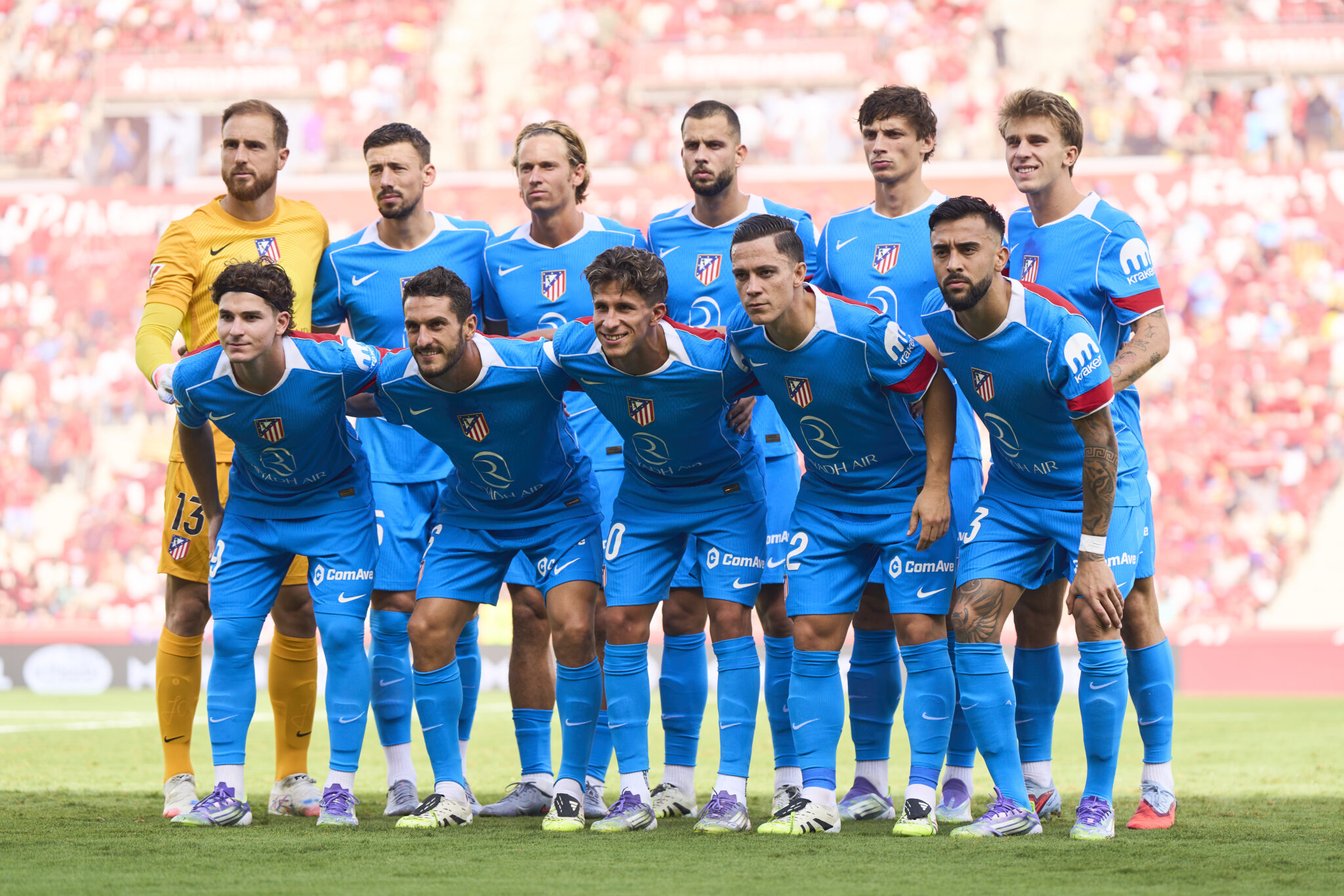 Atletico Madrid players line up for a team photo.