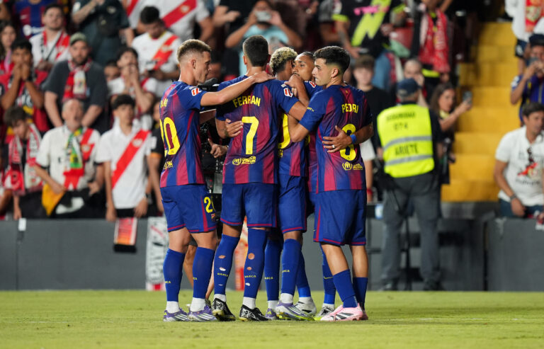 Barcelona players celebrate together.