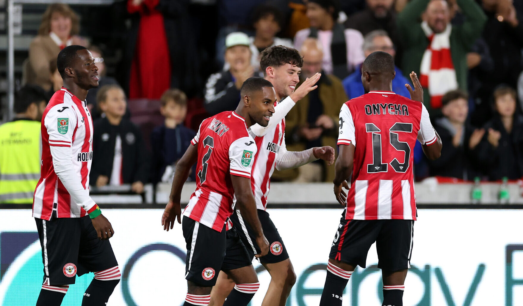 Aaron Hickey of Brentford celebrates scoring his team's first goal with team mate Frank Onyeka during the Carabao Cup Third Round match between Brentford and Aston Villa at Gtech Community Stadium on September 16, 2025 in Brentford, England.