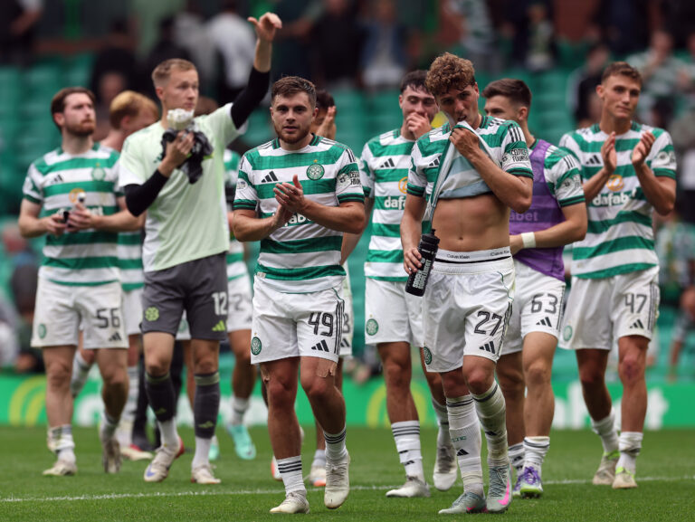 Celtic players look dejected at the end of a game.