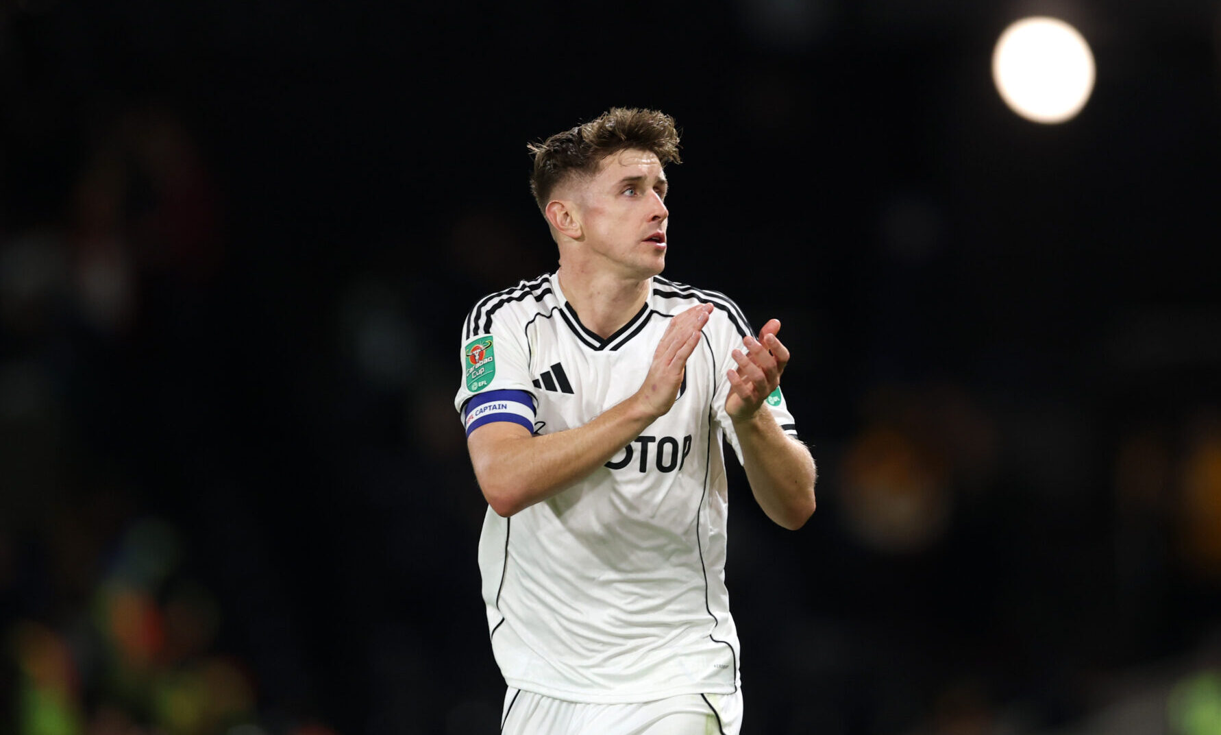 Tom Cairney of Fulham applauds the fans at full-time following the team's victory in the Carabao Cup Third Round match between Fulham and Cambridge United at Craven Cottage on September 23, 2025 in London, England.
