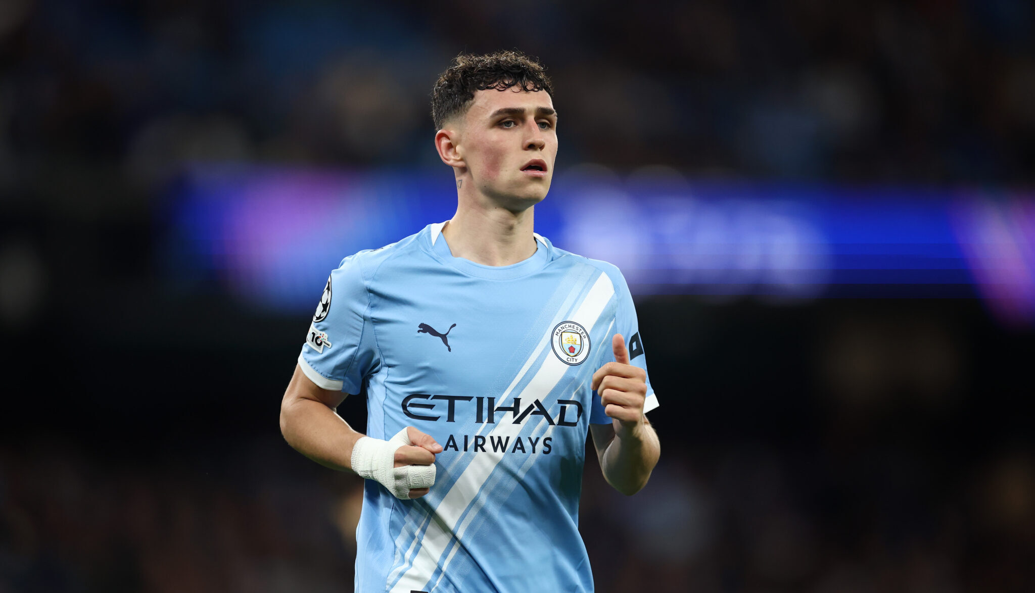 Man City midfielder Phil Foden runs during the UEFA Champions League 2025/26 League Phase MD1 match between Manchester City and SSC Napoli at City of Manchester Stadium on September 18, 2025 in Manchester, England.