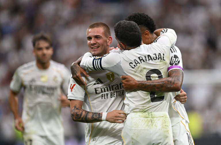 Real Madrid players celebrate a goal.