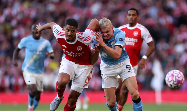 William Saliba of Arsenal battles for possession with Erling Haaland of Man City during the Premier League match between Arsenal and Manchester City at Emirates Stadium on September 21, 2025 in London, England.