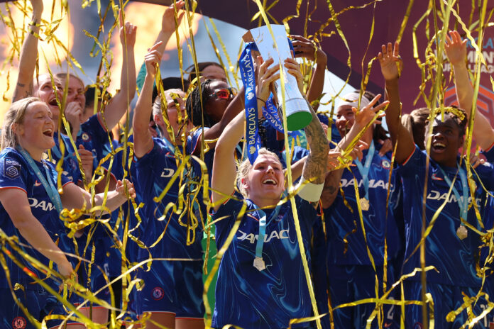 Chelsea captain Millie Bright lifts the Barclays Women's Super League title trophy following the team's victory in the Barclays Women's Super League match between Chelsea FC and Liverpool FC at Stamford Bridge on May 10, 2025 in London, England.
