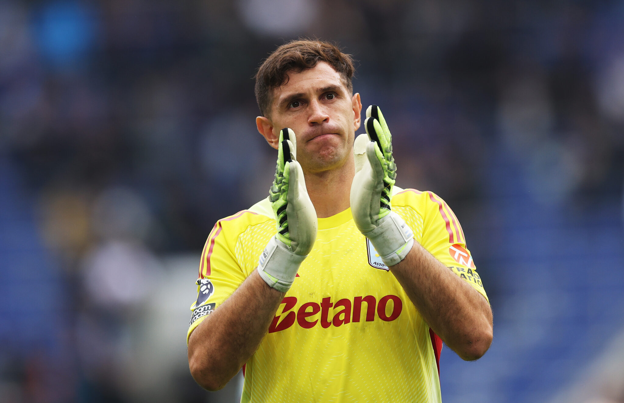 Emi Martinez of Aston Villa applauds the fans after the draw during the Premier League match between Everton and Aston Villa at Hill Dickinson Stadium on September 13, 2025 in Liverpool, England.