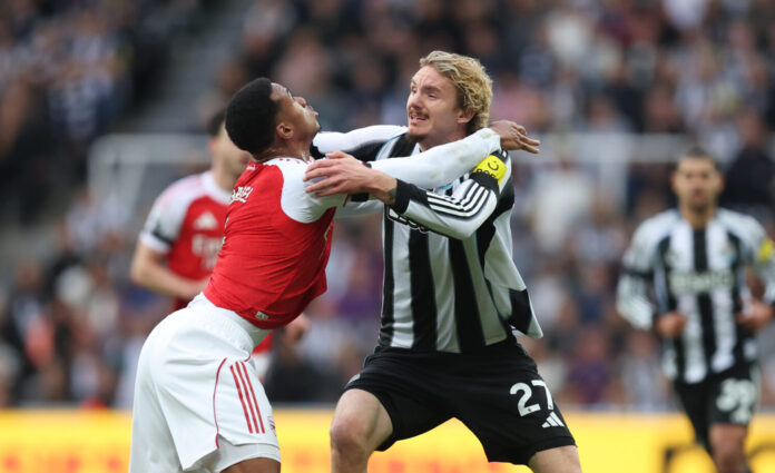 Nick Woltemade of Newcastle United tussles with Gabriel of Arsenal during the Premier League match between Newcastle United and Arsenal at St James' Park on September 28, 2025 in Newcastle upon Tyne, England.