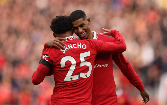 Jadon Sancho of Man Utd celebrates with Marcus Rashford after the latter scored the second goal during the Premier League match between Manchester United and Leicester City at Old Trafford on February 19, 2023 in Manchester, England.