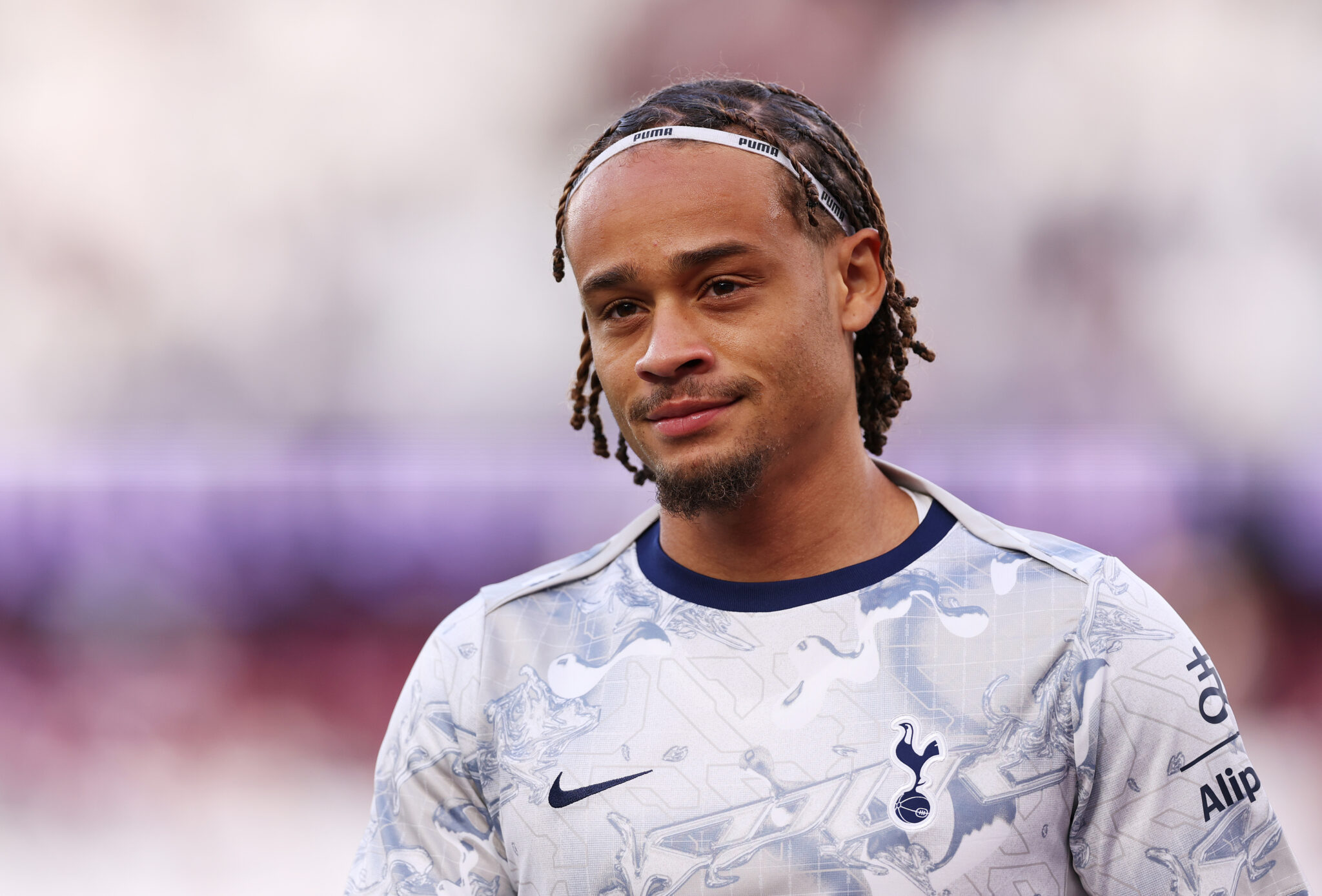 Xavi Simons of Tottenham Hotspur looks on during the warm up prior to the Premier League match between West Ham United and Tottenham Hotspur at London Stadium on September 13, 2025 in London, England.