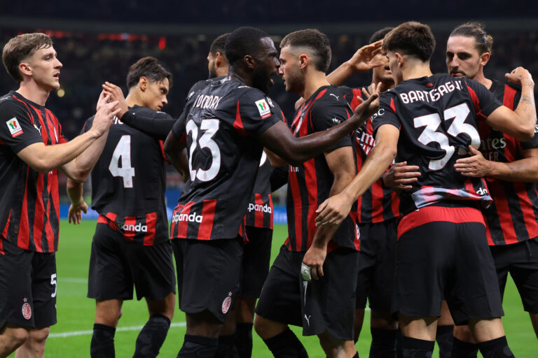 AC Milan players celebrate a goal.