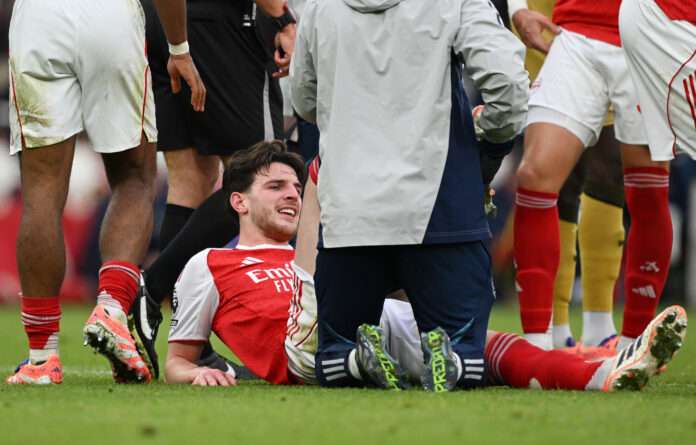 Arsenal player Declan Rice receives medical treatment during the Premier League match between Arsenal and Crystal Palace at Emirates Stadium on October 26, 2025 in London, England.