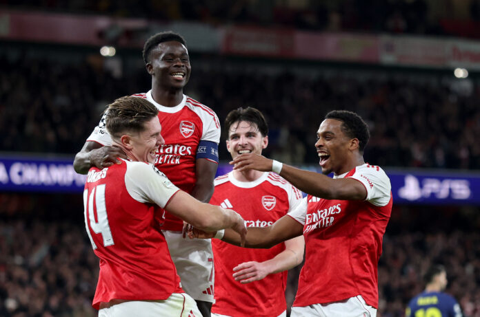 Arsenal striker Viktor Gyokeres of celebrates scoring his team's third goal with teammates Bukayo Saka and Jurrien Timber during the UEFA Champions League 2025/26 League Phase MD3 match between Arsenal FC and Atletico de Madrid at Arsenal Stadium on October 21, 2025 in London, England.