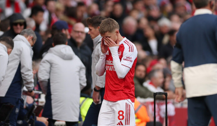Arsenal captain Martin Odegaard looks dejected as he leaves the pitch injured during the Premier League match between Arsenal and West Ham United at Emirates Stadium on October 04, 2025 in London, England.
