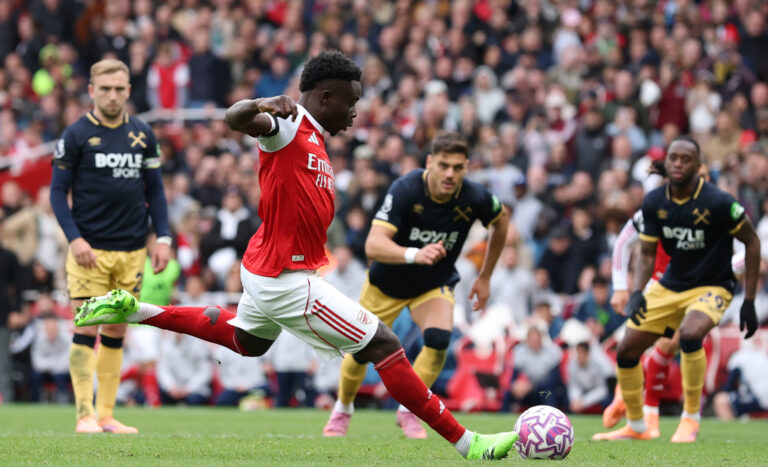 Bukayo Saka of Arsenal scores his team's second goal from the penalty spot during the Premier League match between Arsenal and West Ham United at Emirates Stadium on October 04, 2025 in London, England.