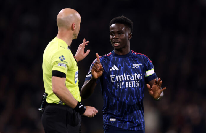 Bukayo Saka of Arsenal appeals to Referee Anthony Taylor after overturning his initial decision of a penalty for Arsenal following a VAR Review during the Premier League match between Fulham and Arsenal at Craven Cottage on October 18, 2025 in London, England.