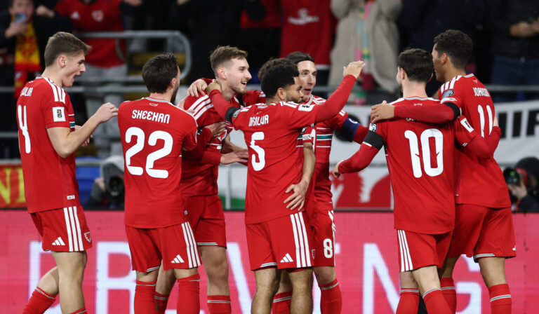 David Brooks of Wales (third left) celebrates scoring his team's second goal with teammates during the FIFA World Cup 2026 qualifier match between Wales and North Macedonia at Cardiff City Stadium on November 18, 2025 in Cardiff, Wales.