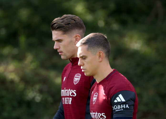 Arsenal players Viktor Gyokeres and Leandro Trossard make their way out for a training session at Sobha Realty Training Centre on September 30, 2025 in London Colney, England.