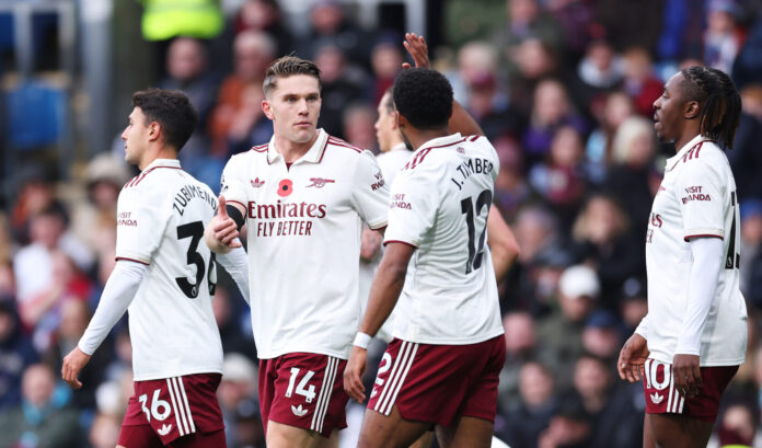 Viktor Gyokeres of Arsenal celebrates scoring his team's first goal with teammate Jurrien Timber during the Premier League match between Burnley and Arsenal at Turf Moor on November 01, 2025 in Burnley, England.