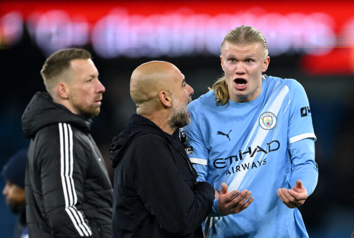 Erling Haaland of Man City speaks with Pep Guardiola, Manager of Manchester City, after the Premier League match between Manchester City and Leeds United at Etihad Stadium on November 29, 2025 in Manchester, England.