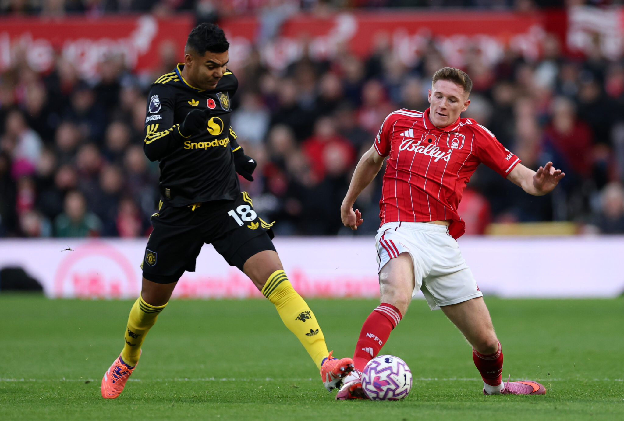 Elliot Anderson of Nottingham Forest battles for possession with Casemiro of Man Utd during the Premier League match between Nottingham Forest and Manchester United at City Ground on November 01, 2025 in Nottingham, England.