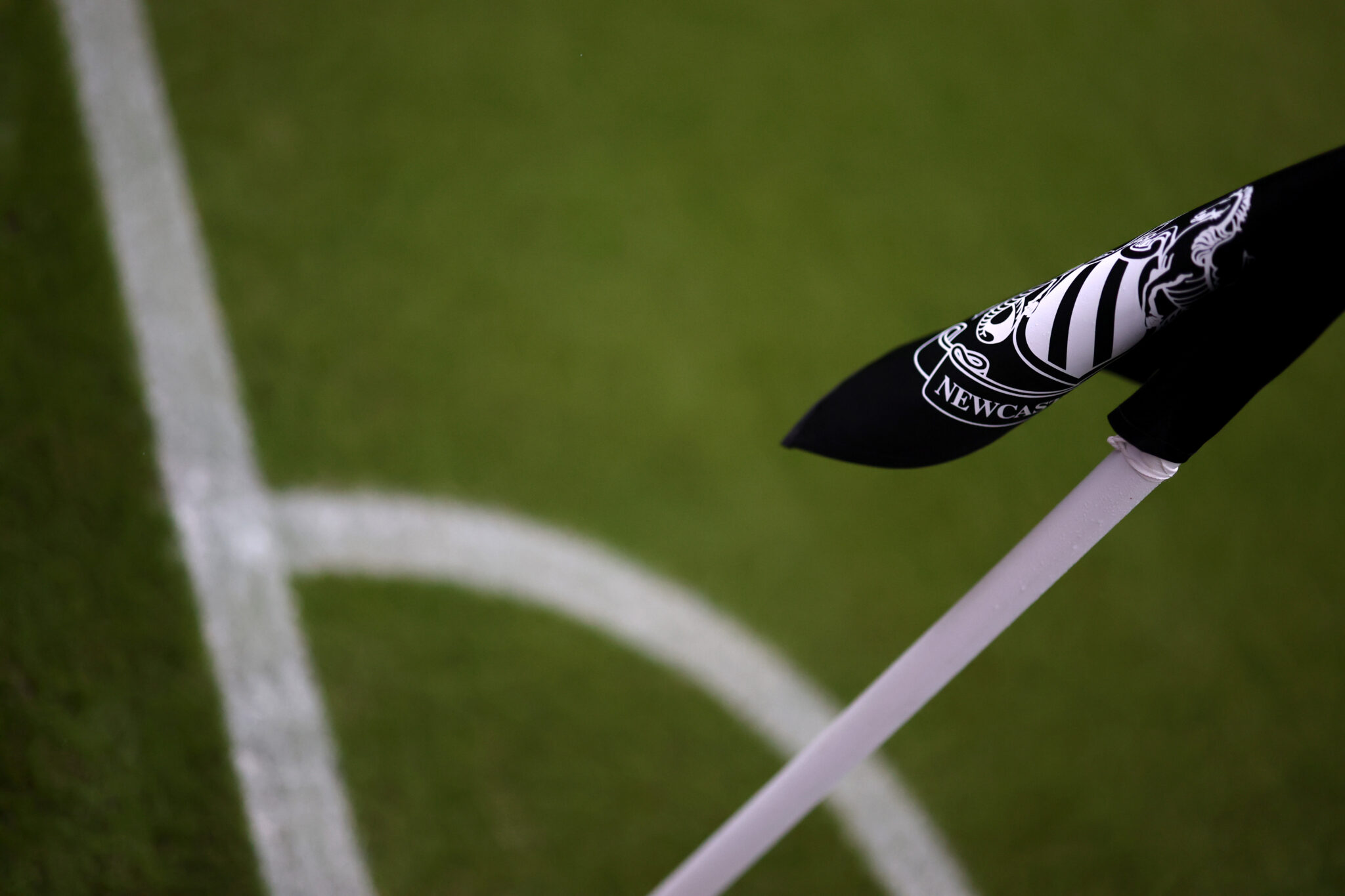 A detailed view of Newcastle United badge displayed on the corner flag prior to the UEFA Champions League 2025/26 League Phase MD3 match between Newcastle United FC and SL Benfica at St James' Park on October 21, 2025 in Newcastle upon Tyne, England.