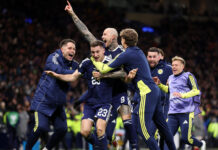 Scotland seal World Cup berth, Wales heading to play-offs Kenny McLean of Scotland celebrates scoring his team's fourth goal with teammates during the FIFA World Cup 2026 qualifier match between Scotland and Denmark at Hampden Park on November 18, 2025 in Glasgow, Scotland.
