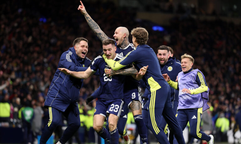 Kenny McLean of Scotland celebrates scoring his team's fourth goal with teammates during the FIFA World Cup 2026 qualifier match between Scotland and Denmark at Hampden Park on November 18, 2025 in Glasgow, Scotland.