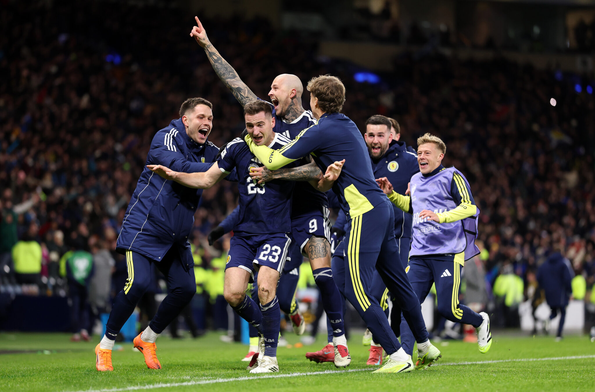 Kenny McLean of Scotland celebrates scoring his team's fourth goal with teammates during the FIFA World Cup 2026 qualifier match between Scotland and Denmark at Hampden Park on November 18, 2025 in Glasgow, Scotland.