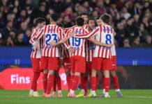 Atletico Madrid XI vs Deportivo La Coruna – Predicted lineup and team news Atletico Madrid players huddle together.
