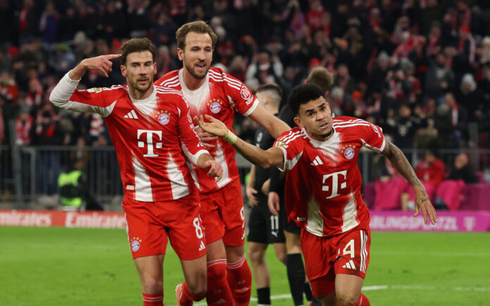 Bayern Munich players Leon Goretzka, Harry Kane and Luis Diaz celebrate a goal.