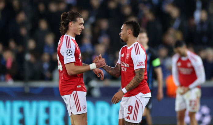 Gabriel Jesus of Arsenal shakes hands with his teammate Riccardo Calafiori after the UEFA Champions League 2025/26 League Phase MD6 match between Club Brugge KV and Arsenal FC at Jan Breydelstadion on December 10, 2025 in Bruges, Belgium.