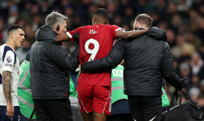 Liverpool striker Alexander Isak is carried off the pitch after sustaining an injury.