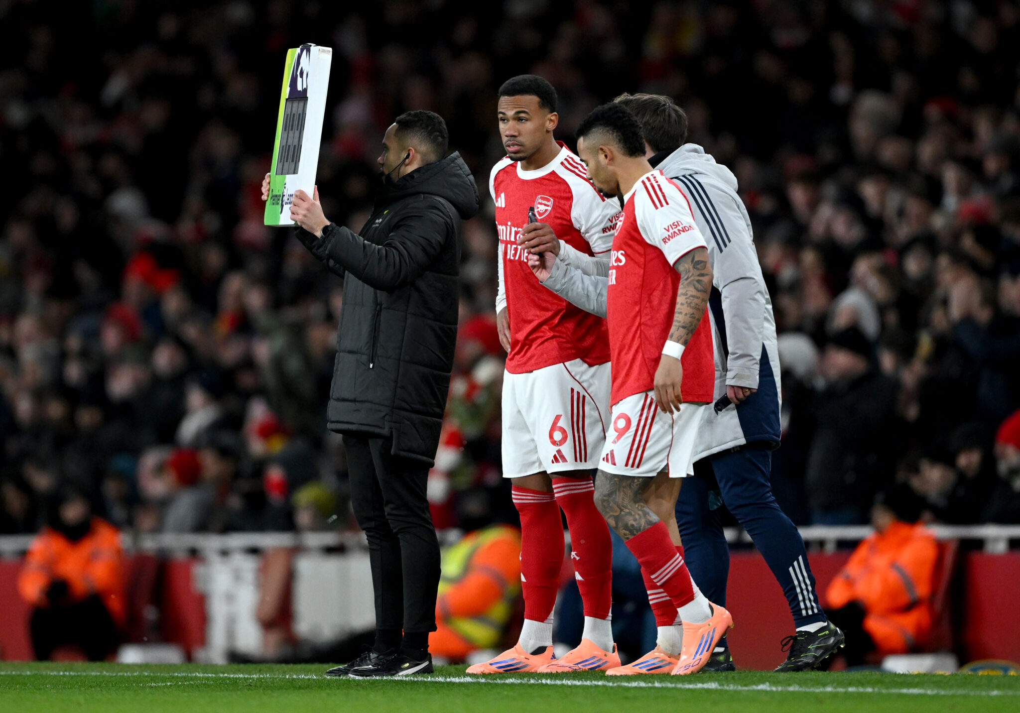 Gabriel and Gabriel Jesus of Arsenal prepare to come on as substitutes during the Premier League match between Arsenal and Brighton & Hove Albion at the Emirates Stadium on December 27, 2025 in London, England.