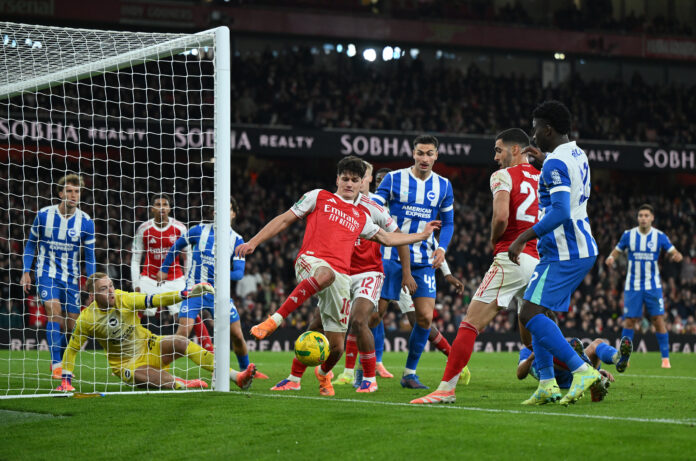 Arsenal player Christian Norgaard stretches for the ball during the Carabao Cup Fourth Round match between Arsenal and Brighton & Hove Albion at Emirates Stadium on October 29, 2025 in London, England.