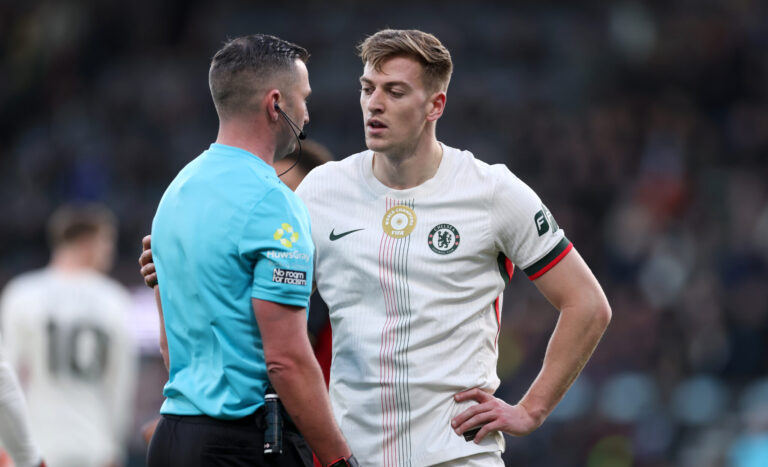 Liam Delap of Chelsea talks with referee Michael Oliver during the Premier League match between Bournemouth and Chelsea at Vitality Stadium on December 06, 2025 in Bournemouth, England.