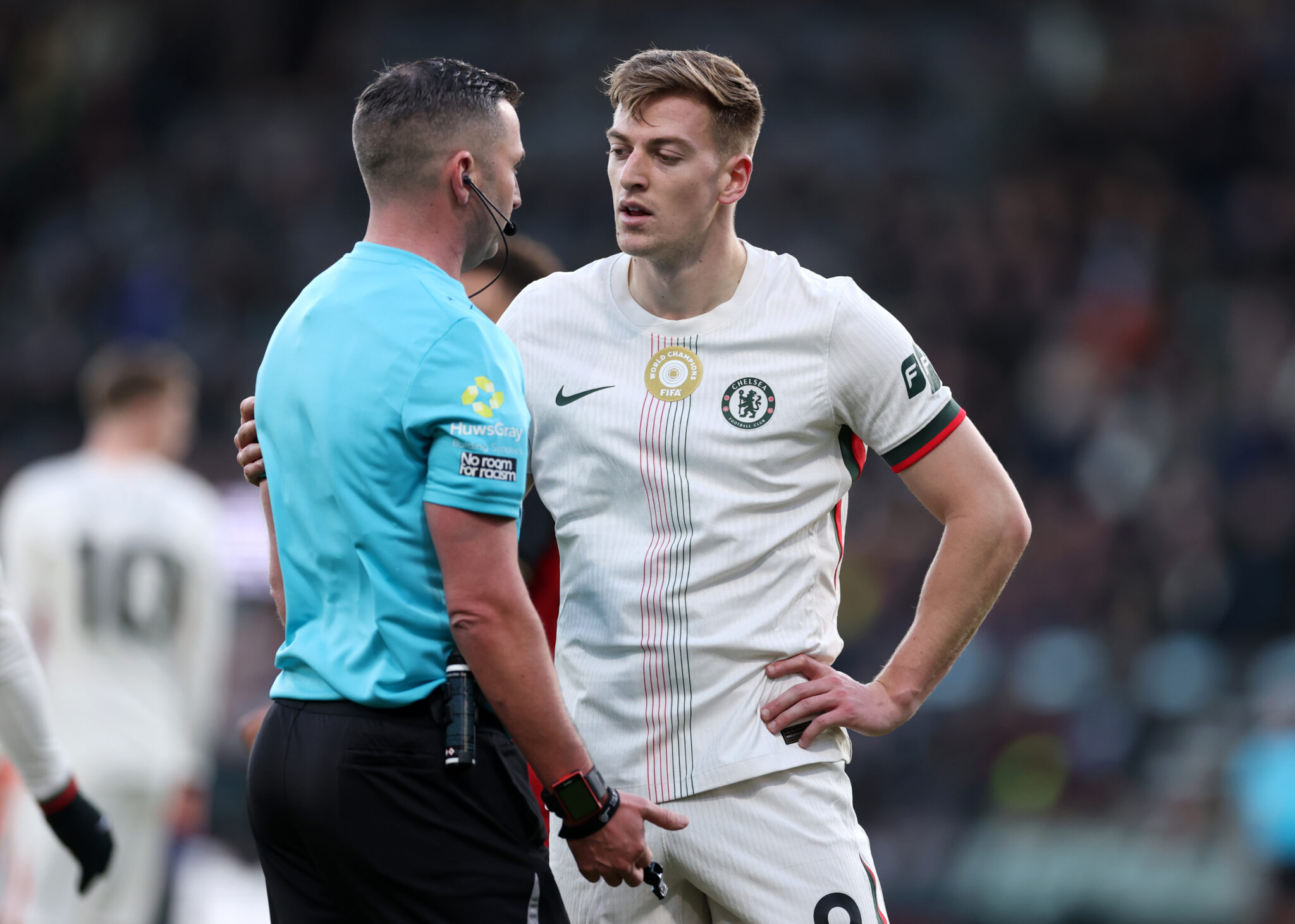 Liam Delap of Chelsea talks with referee Michael Oliver during the Premier League match between Bournemouth and Chelsea at Vitality Stadium on December 06, 2025 in Bournemouth, England.