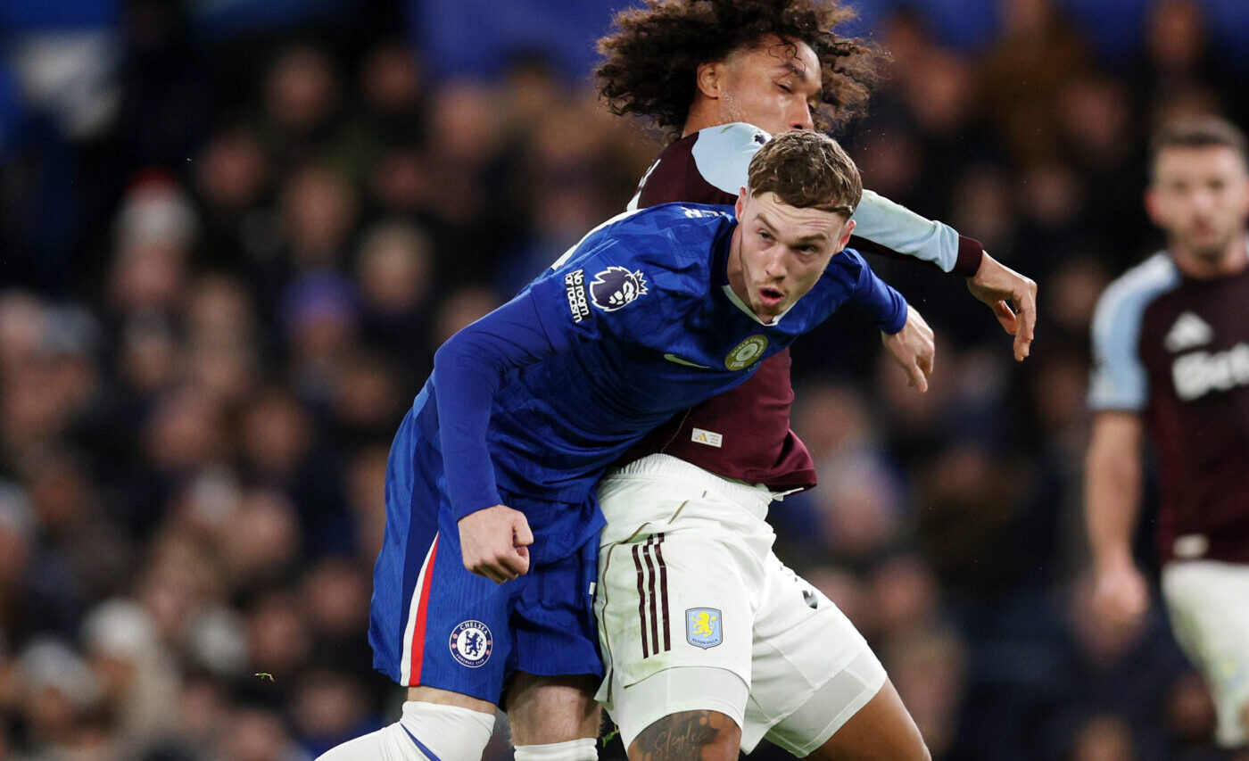 Cole Palmer of Chelsea is challenged by Boubacar Kamara of Aston Villa during the Premier League match between Chelsea and Aston Villa at Stamford Bridge on December 27, 2025 in London, England.