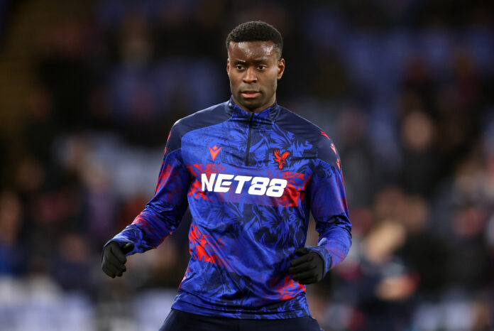 Marc Guehi of Crystal Palace warms up prior to the Premier League match between Crystal Palace and Tottenham Hotspur at Selhurst Park on December 28, 2025 in London, England.
