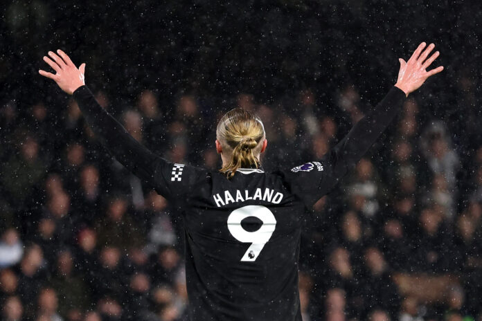Erling Haaland of Man City celebrates scoring his team's first goal, making him the fastest Premier League player to score 100 goals during the Premier League match between Fulham and Manchester City at Craven Cottage on December 02, 2025 in London, England.